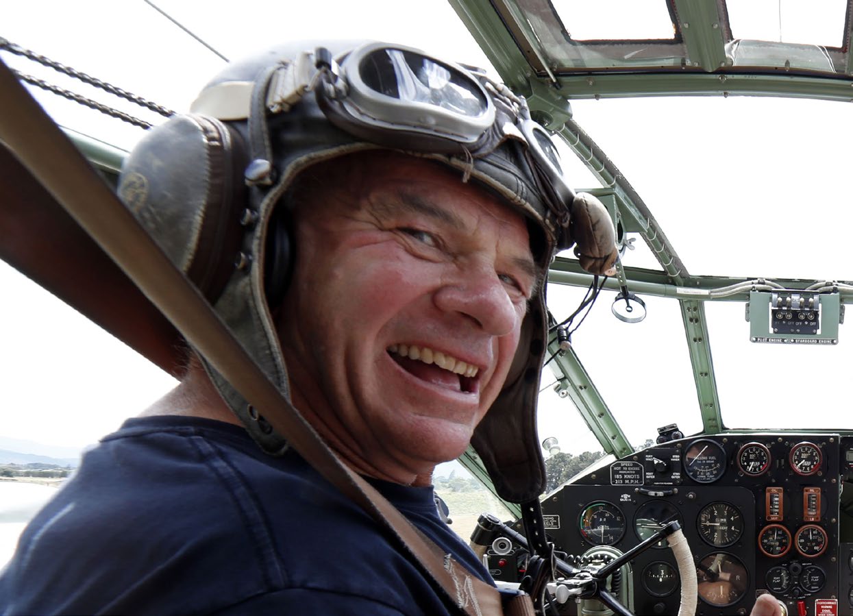 Pilots like Bill Reid (top right) worked 11 to 12 hour days to contain the fire. Photo: Martin de Ruyter, stuff.co.nz