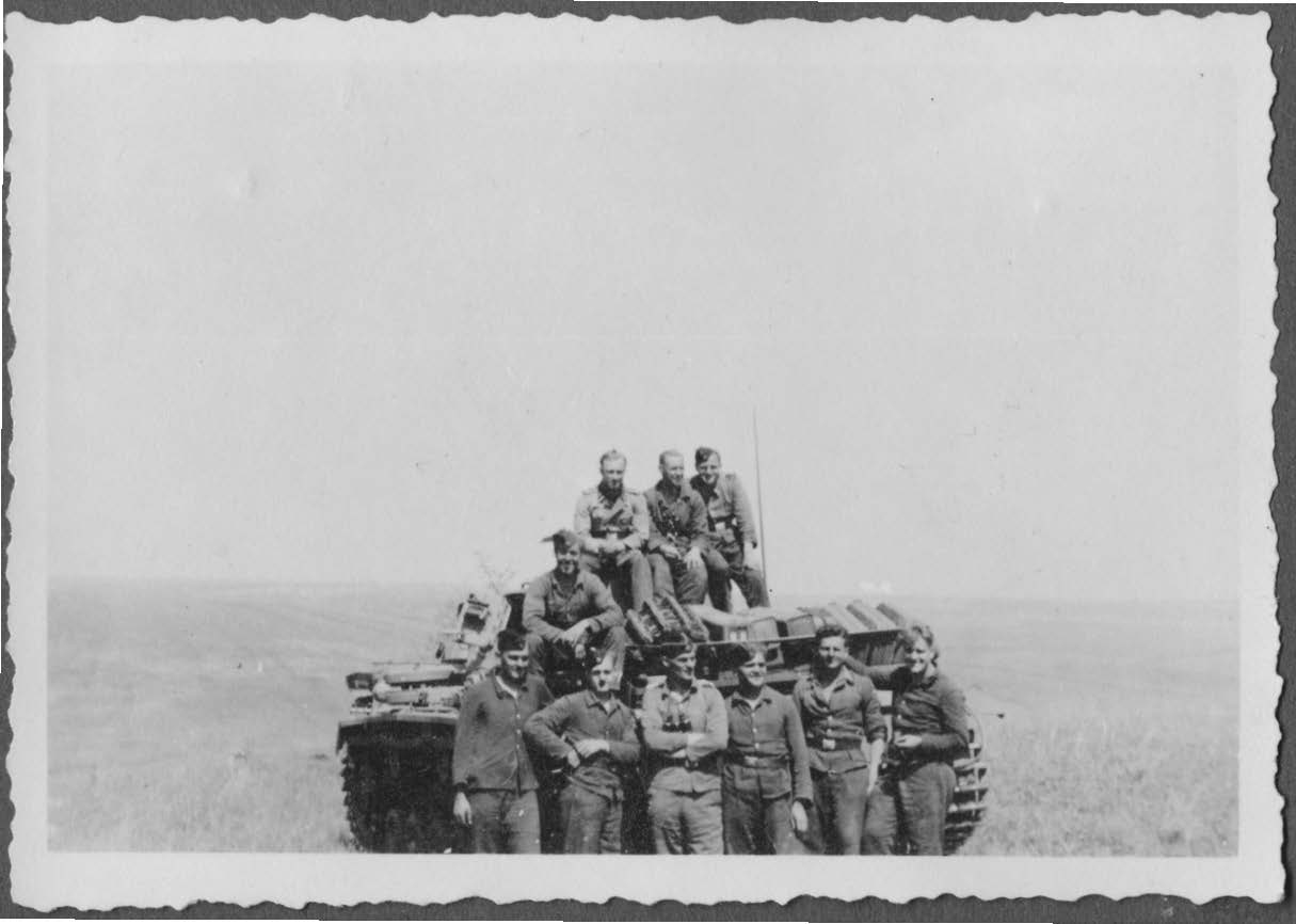 Several tank men of 2nd SS-Panzer Division Das Reich on the vast steppe during Nazi Germany’s advance into Russia. Huber is recorded as sitting on the turret at left. His commanding officer Captain Karl Kloskowski is in the front row with arms crossed, third from left. Source: Rüdiger Warnick Collection.