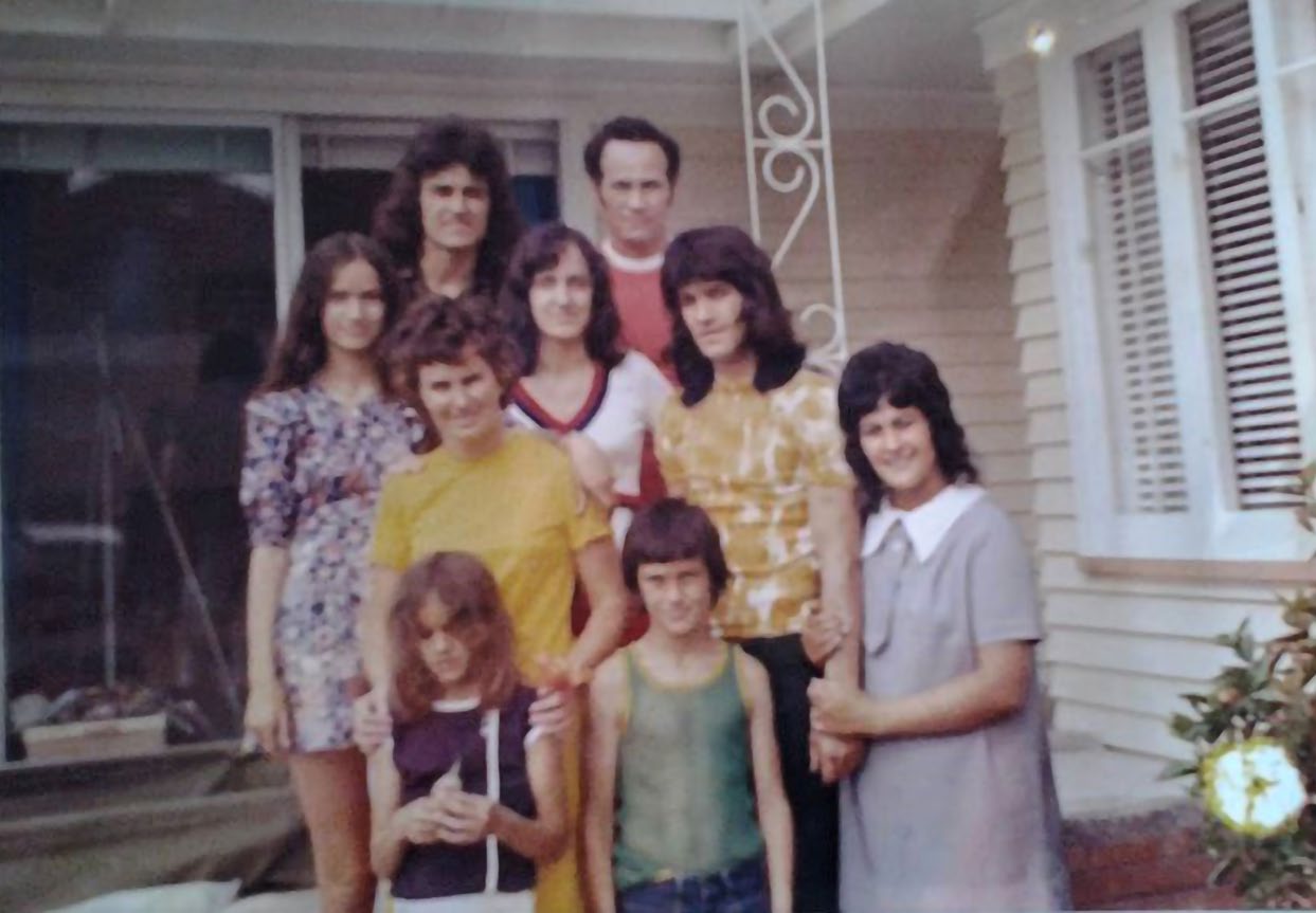 Mark Gosche (back left) in front of the home his parents purchased on a modest income with the help of a state-backed loan. Photo: Supplied.. The family was living in a one-room motel. Photo: Dean Purcell, New Zealand Herald.