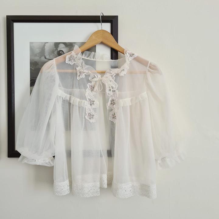 Blouse on hanger.