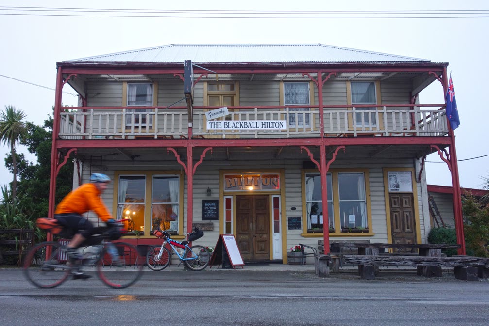 A rider whizzes past the Blackball Hilton, near Greymouth