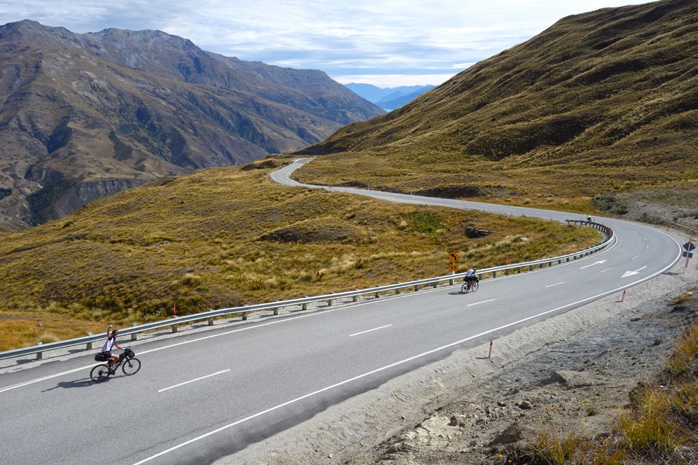 All downhill from here: bikers descend the Crown Range, near Queenstown