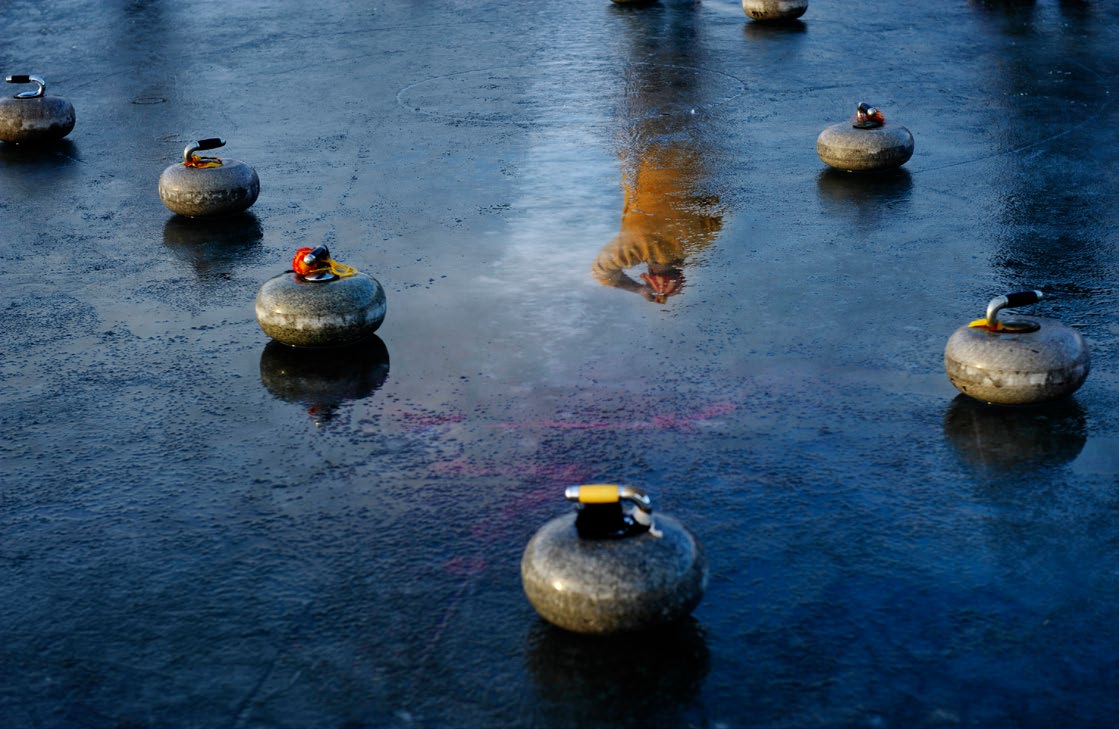 Curling stones on the Idaburn Dam during Bonspiel.