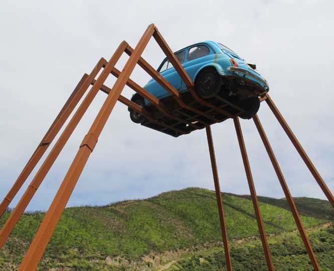 strange sculpture of car with legs