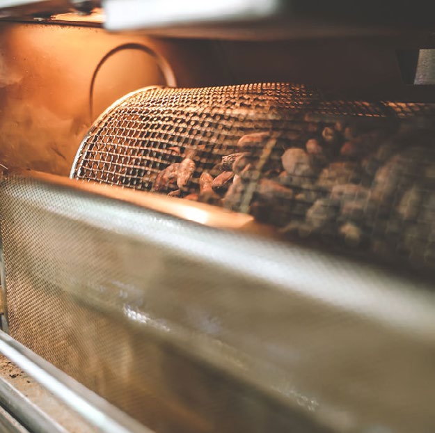 Roasting cacao beans.