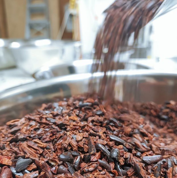 The winnowing process which leaves behind pieces of pure cocoa bean, known as 'nibs'.