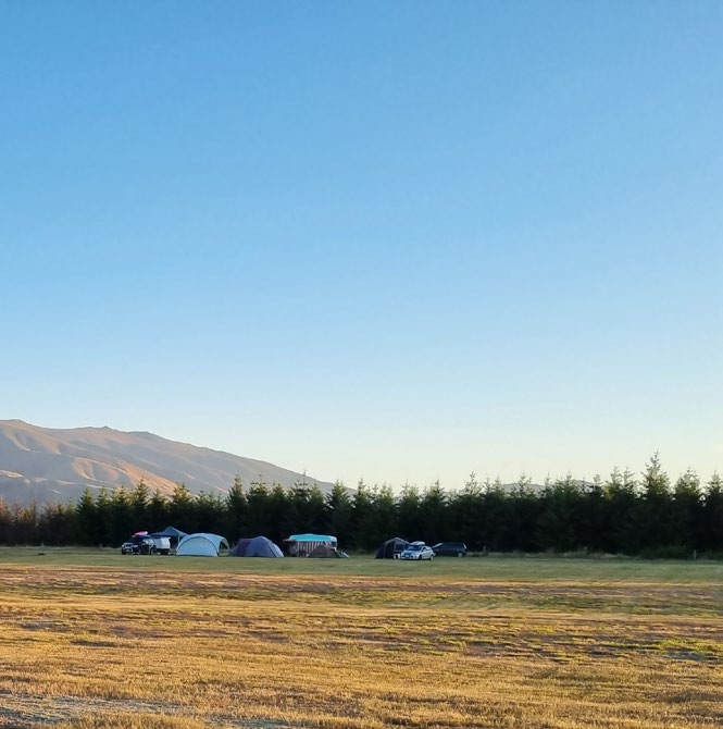 Campbell says her family's set up in Twizel would best be described as glamping — they're fully kitted out, including a solar shower and kitchen area.