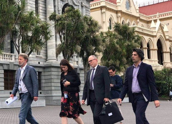 Nahna, right, and other party representatives on their way to a briefing on the day of the Christchurch massacre.